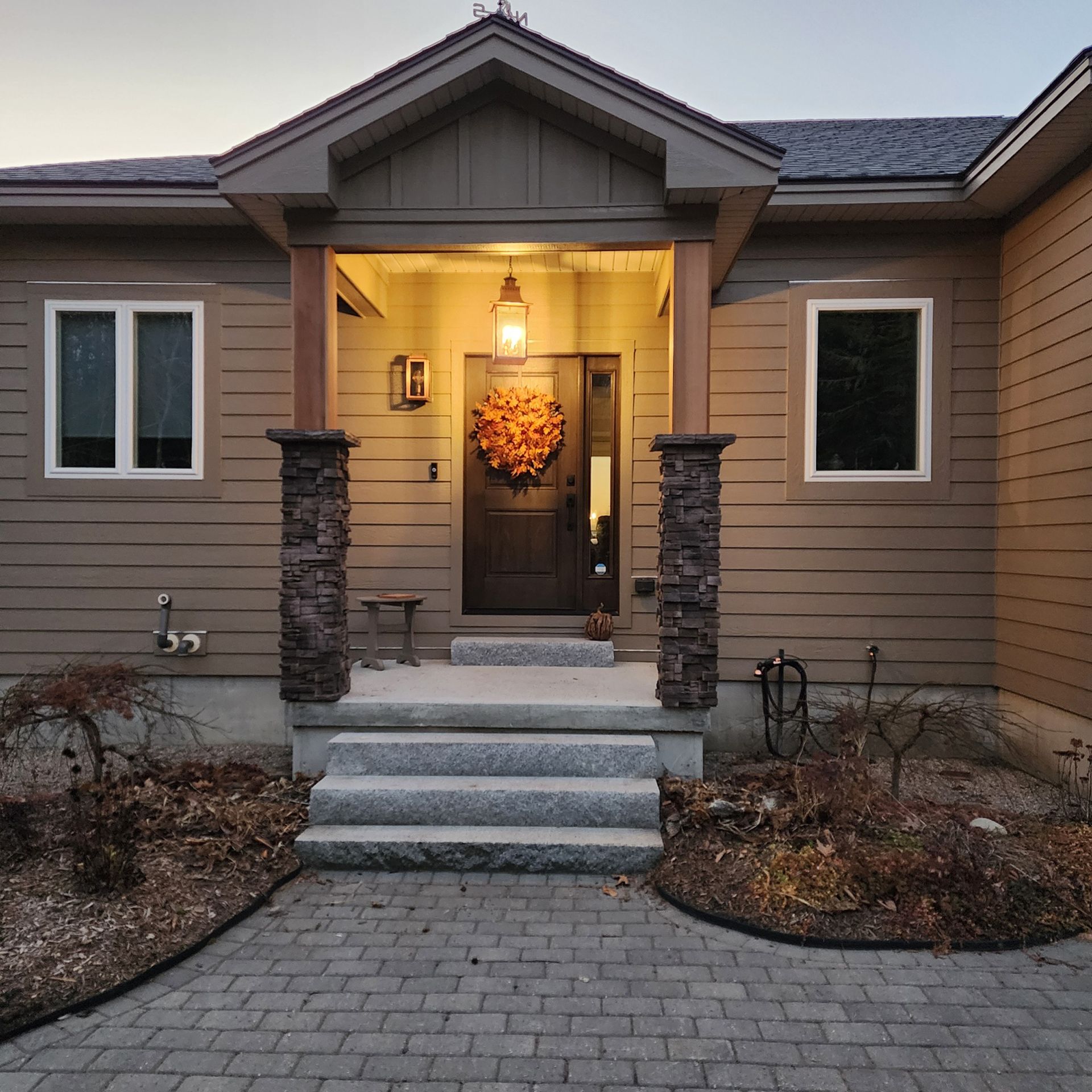 The front of a house with a wreath on the door