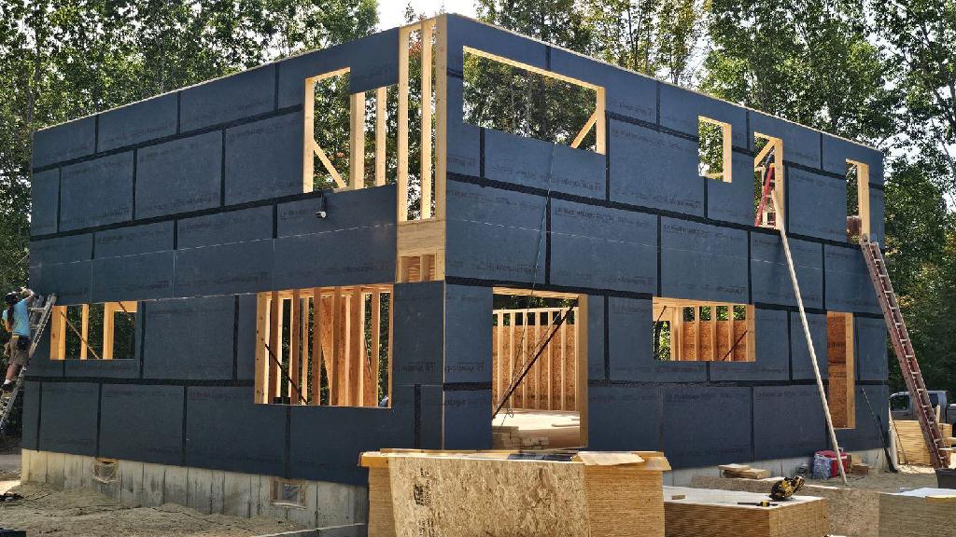 A house that is being built with blue blocks