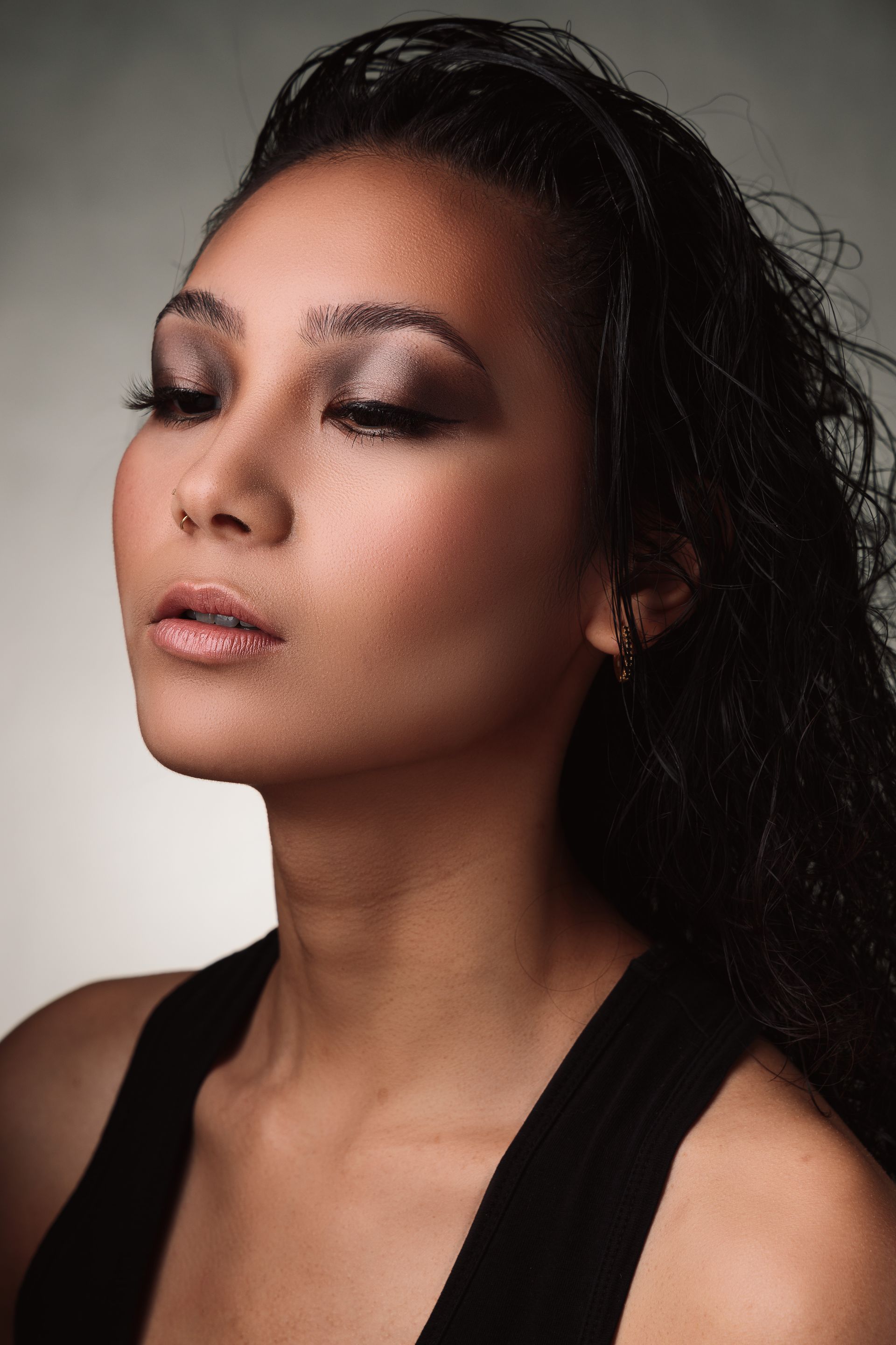 Graceful and Regal – A stunning embodiment of elegance for the 'Face of Queens' campaign, January 2024. This look celebrates the strength and beauty of Asian royalty, with a flawless finish and soft, smoky eyes that exude confidence.