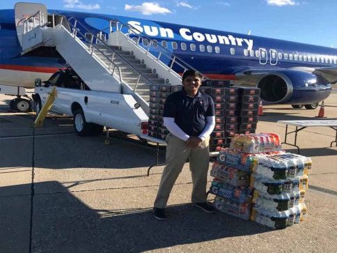 Deven Delivering Boxed Lunches to an Airplane