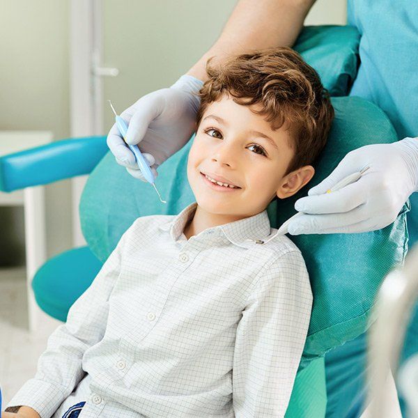 Happy kid on the dentist — Ashland and Ruther Glen, VA — Ashland Family Dentistry