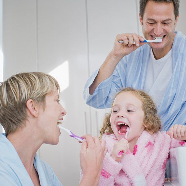 Family brushing their teeth together — Ashland and Ruther Glen, VA — Ashland Family Dentistry