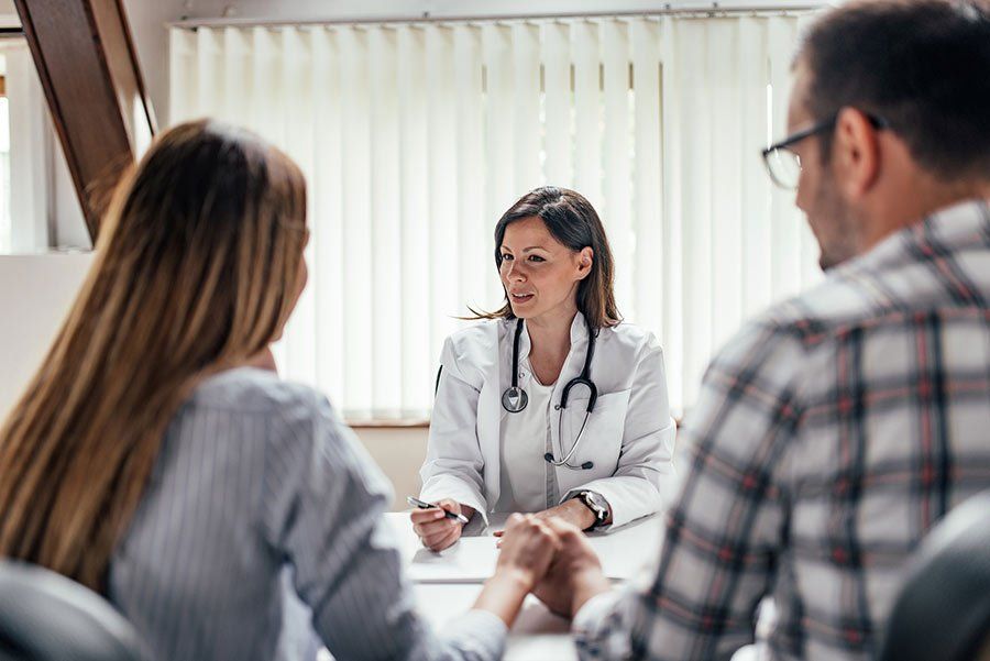 Birth Control — Couple Consulting with a Doctor in Las Vegas, NV