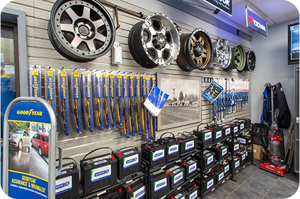 A store filled with lots of tires , batteries , and wiper blades. | TNT Tire Point S Auto Service