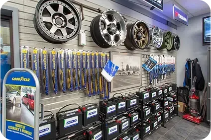 A store filled with lots of tires , batteries , and wiper blades. | TNT Tire Point S Auto Service