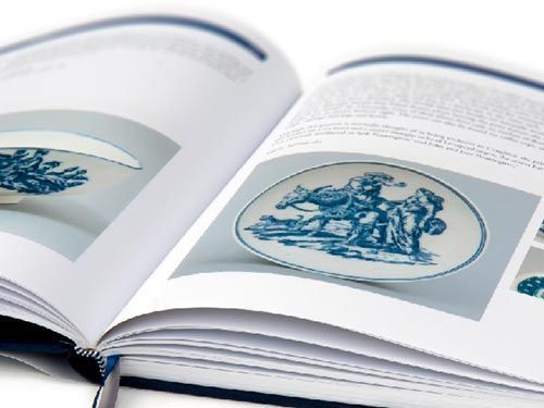 the caughley blue and white patterns book is open to a page with a picture of a plate on it.