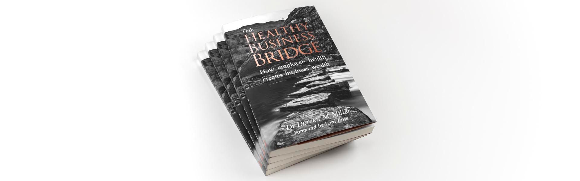 a stack of books titled the healthy business bridge