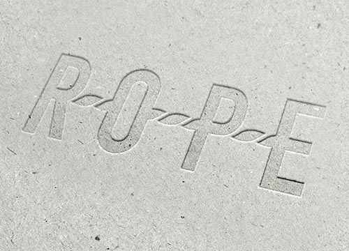 the word rope is embossed into a piece of cardboard .