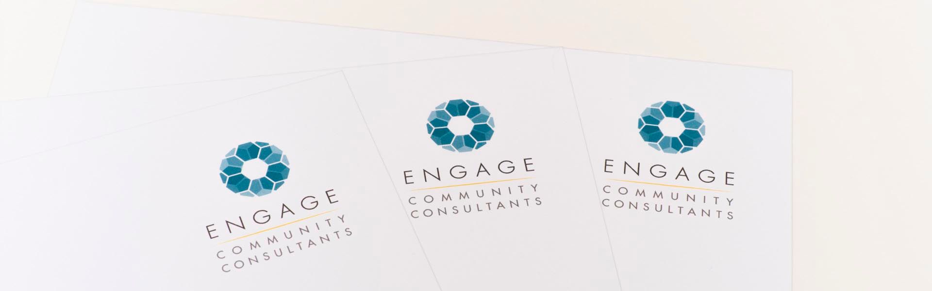 three pieces of paper that say engage community consultants