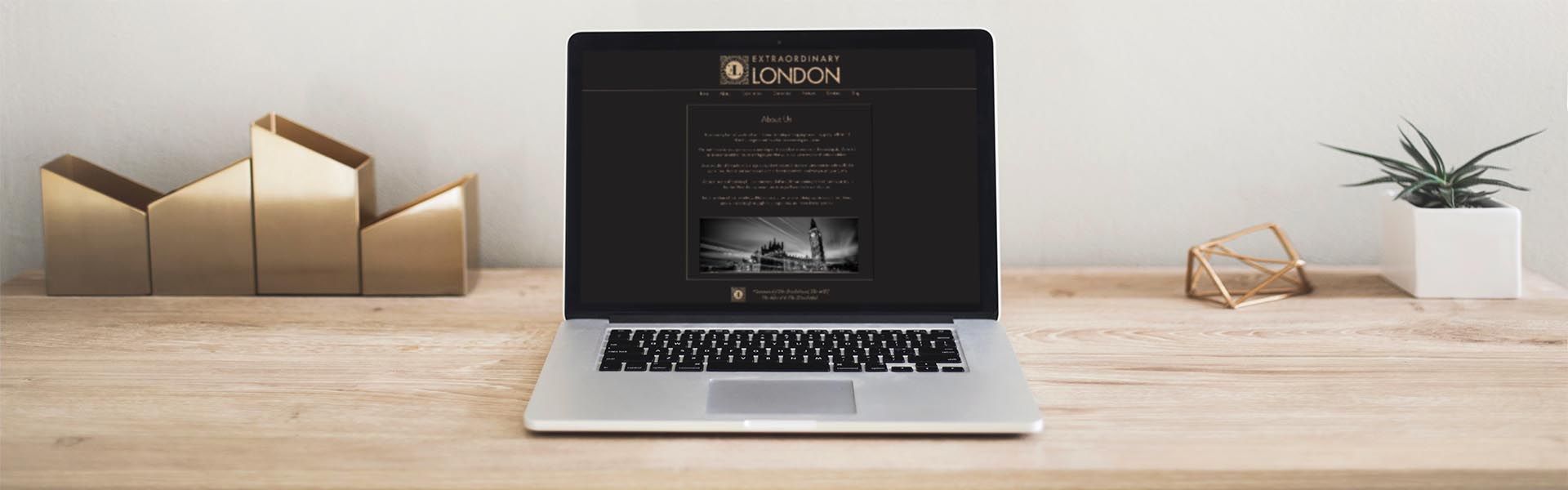 a laptop is open to a page that says extraordinary london