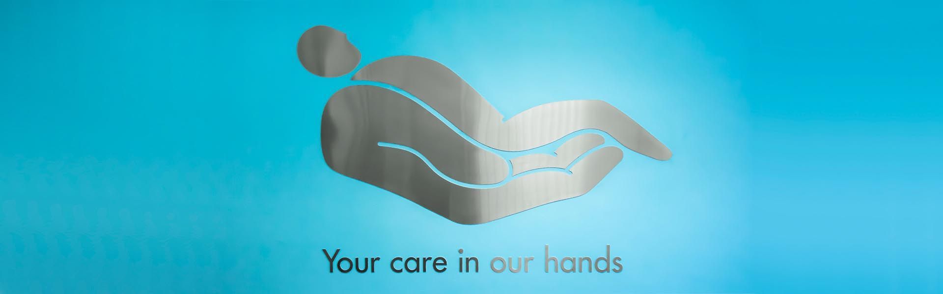 a dentist's sign that says your care in our hands on it