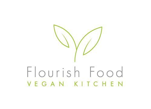a logo for a vegan kitchen with two leaves on a white background .