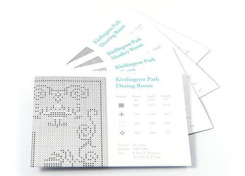 A stack of brochures for kingston park dining room