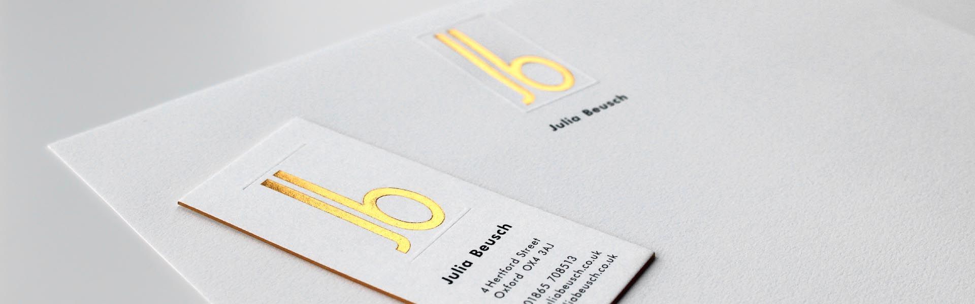 a business card for julia bausch sits on a piece of paper