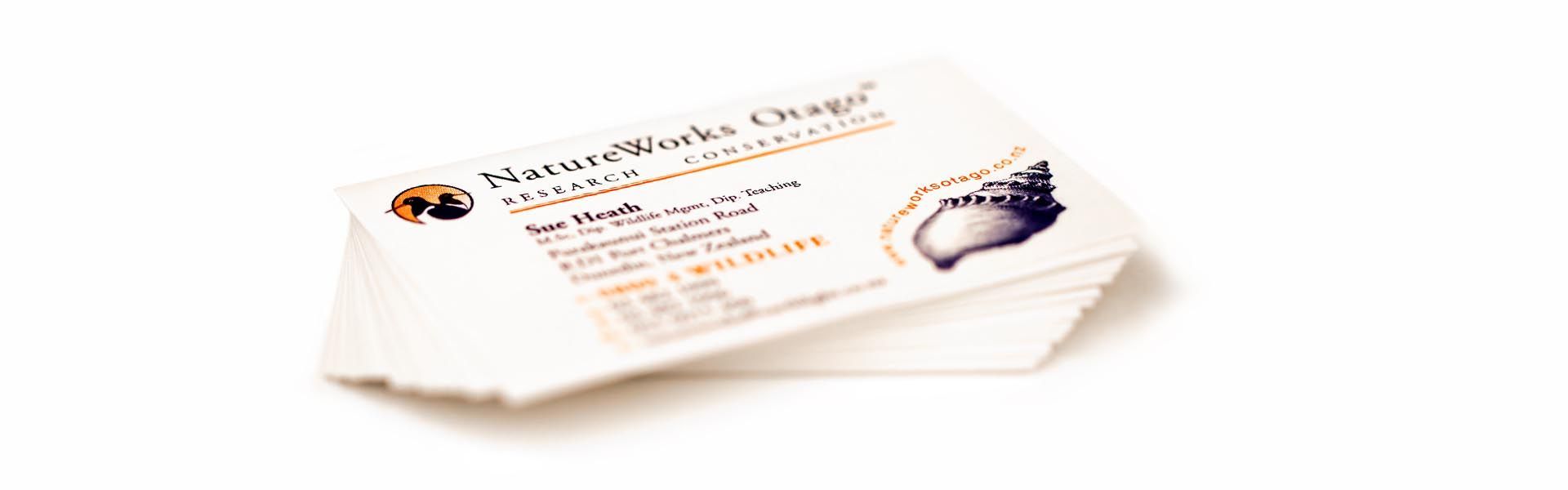 a stack of business cards for natureworks otago