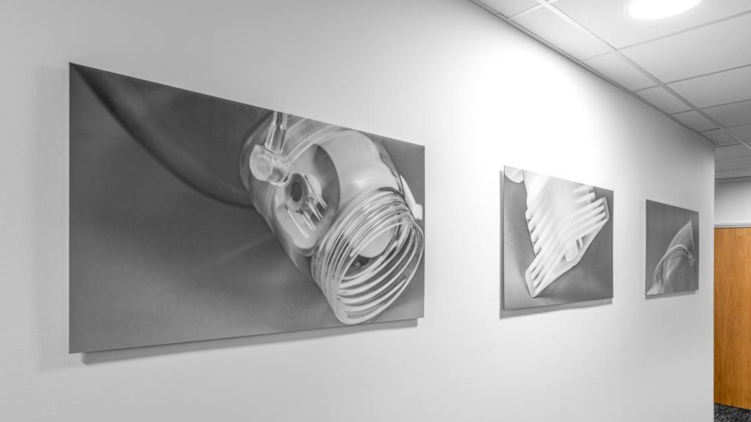 a row of black and white photographs on a wall
