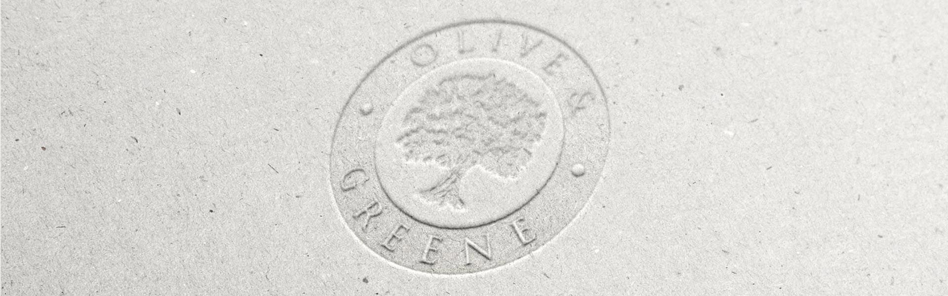 a logo for olive & greene with a tree in the center