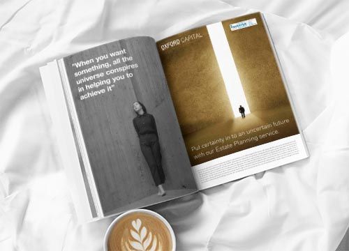 a magazine is open to an advertisement for oxford capital