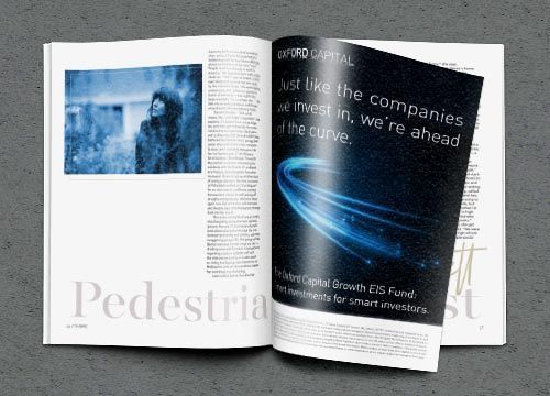 a magazine is open to a page with an advertisement for oxford capital .