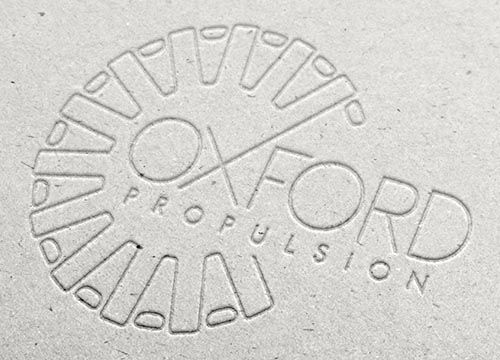 a logo for oxford propulsion is embossed in to grey board