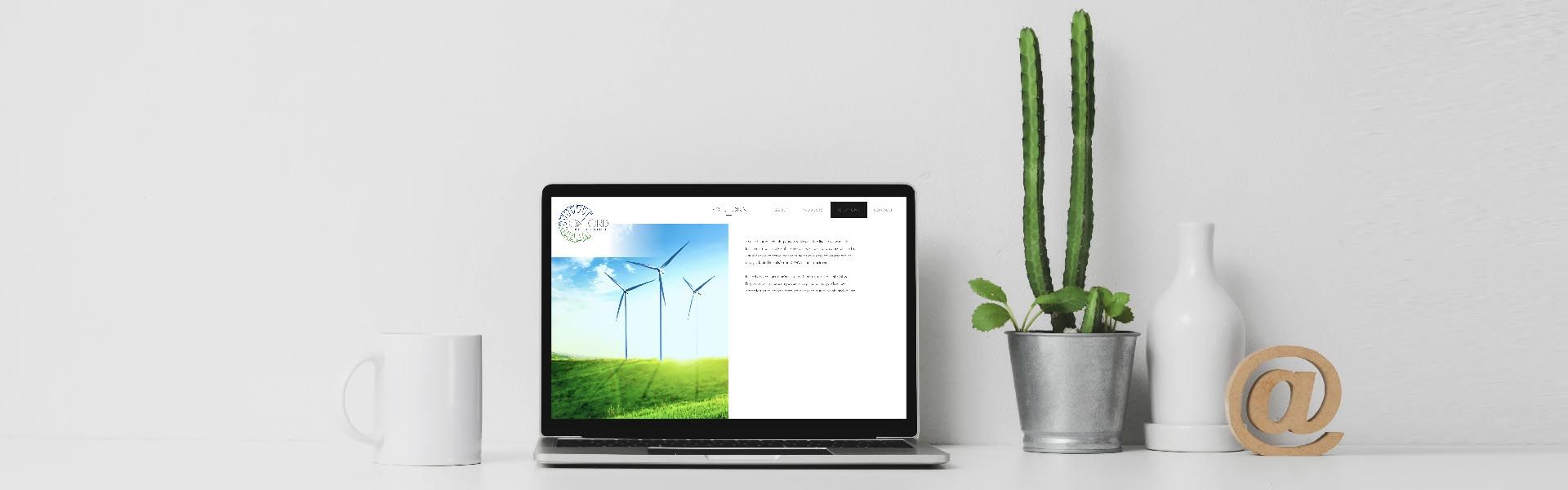 a laptop is open to a website page with a picture of electric wind turbines on it
