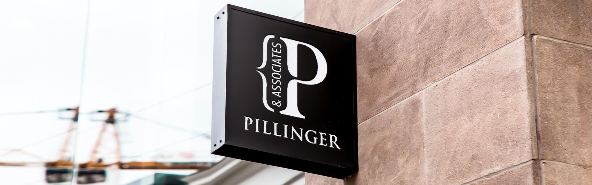 a sign that says pillinger & associates on it