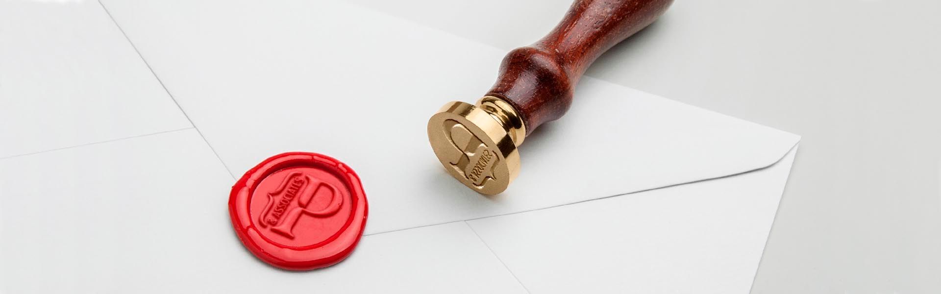 a red wax seal with the pillinger and associates logo on it