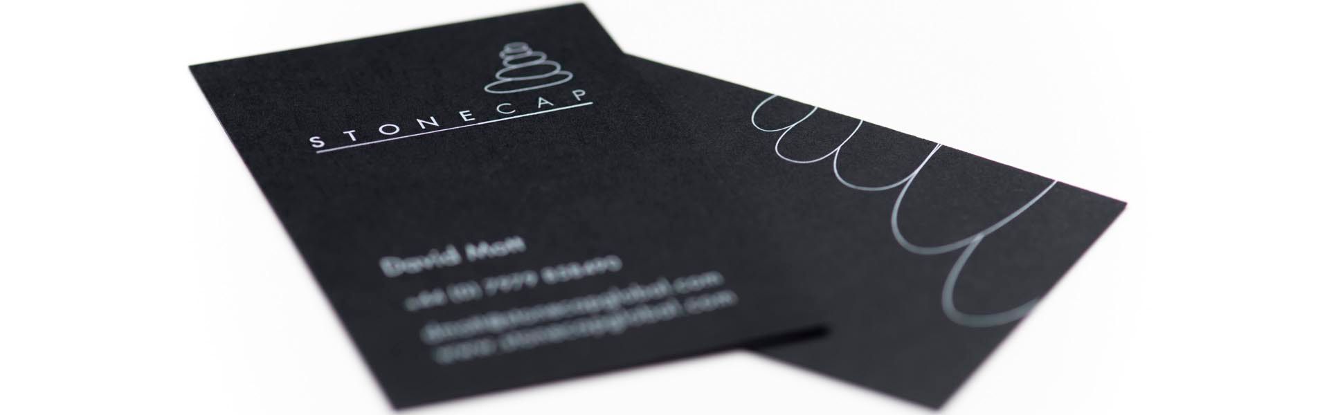 a black business card that says stonecap on it