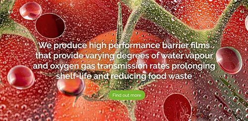 a close up of a tomato with water drops on it .