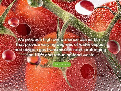 a close up of a tomato with water drops on it.