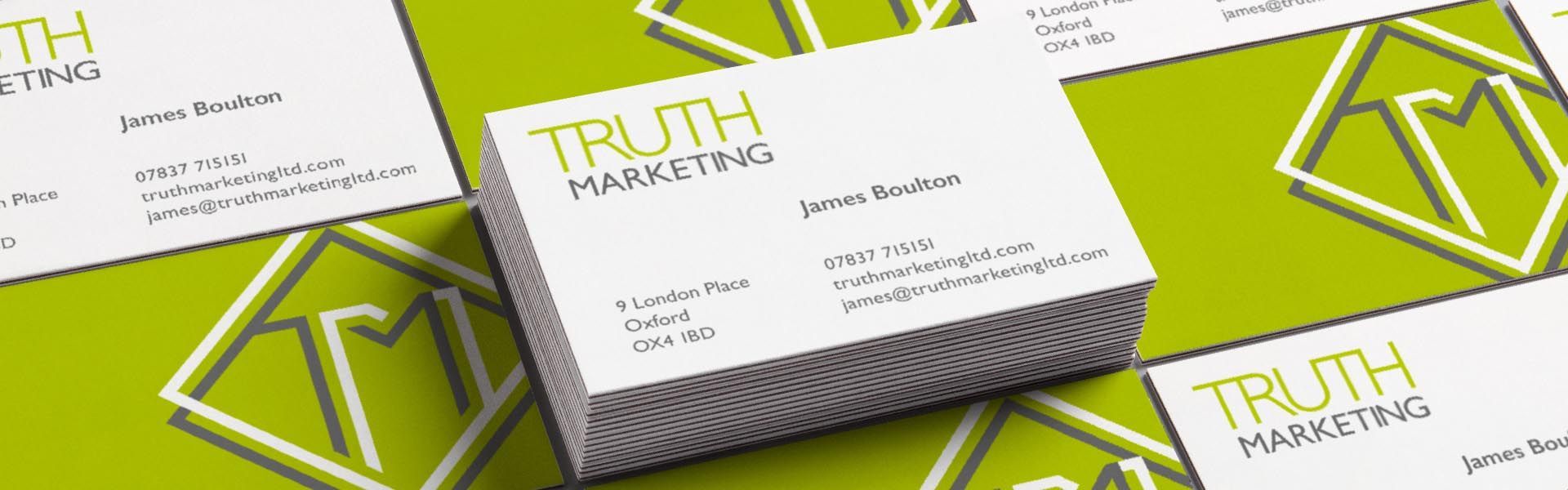 a stack of business cards for truth marketing