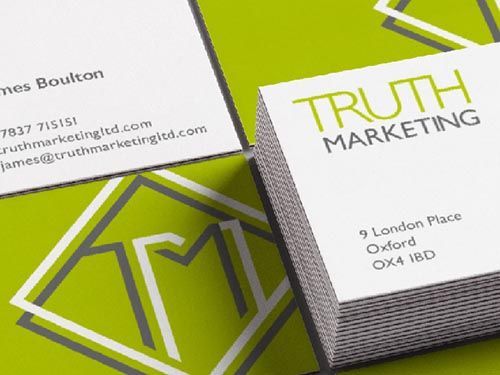 a close up of a stack of business cards for truth marketing.