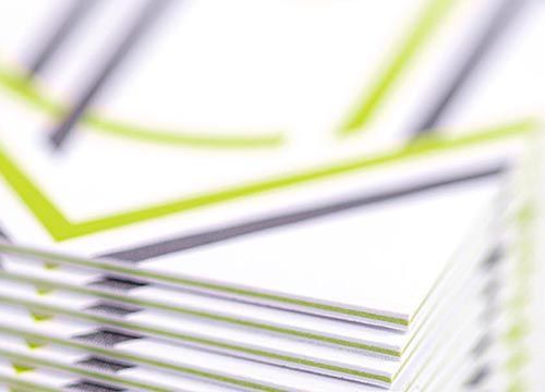 a close up of a stack of business cards on a table .