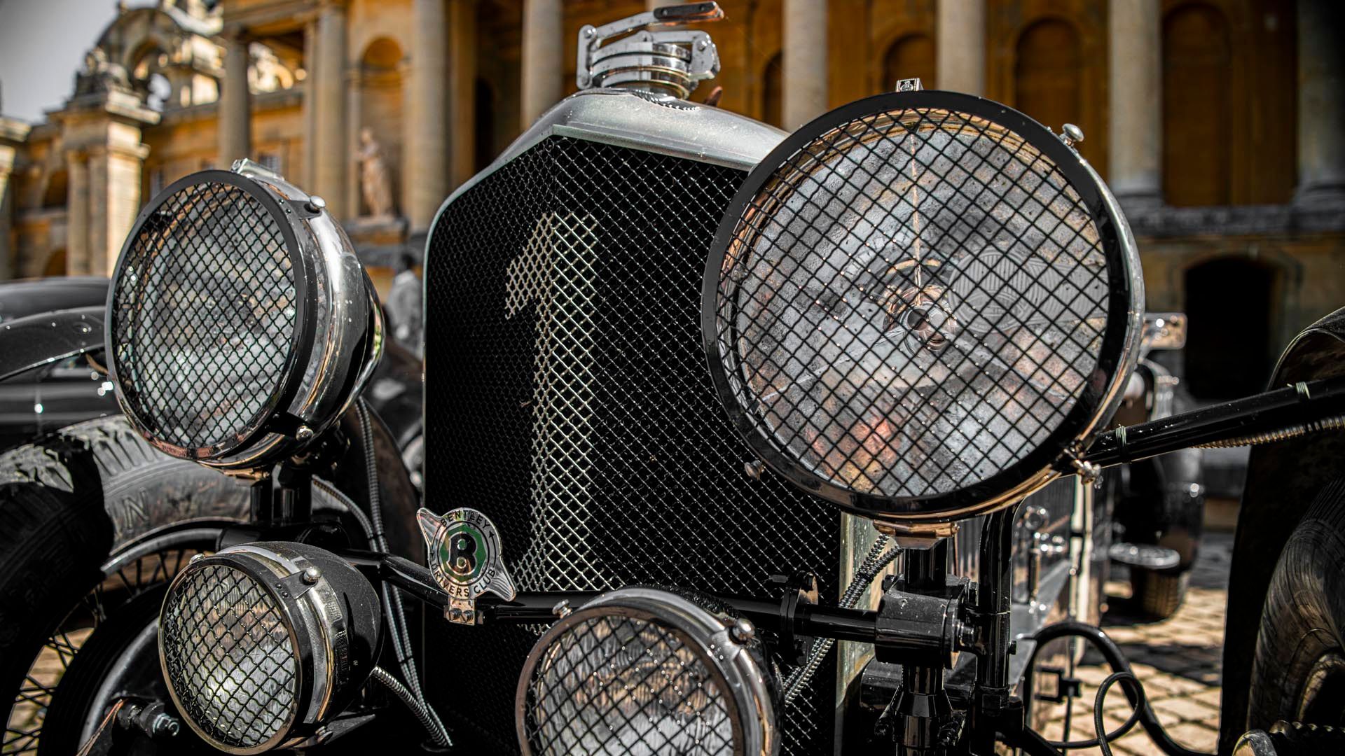 a close up of a classic bentley car with a lot of lights on it .