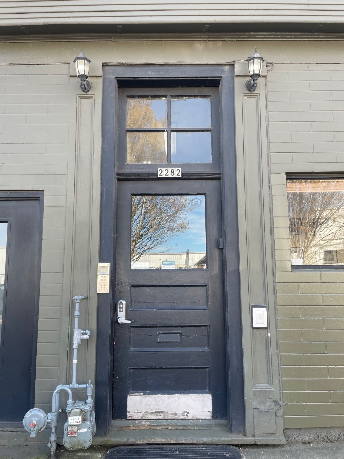 A black door with the number 1337 on it