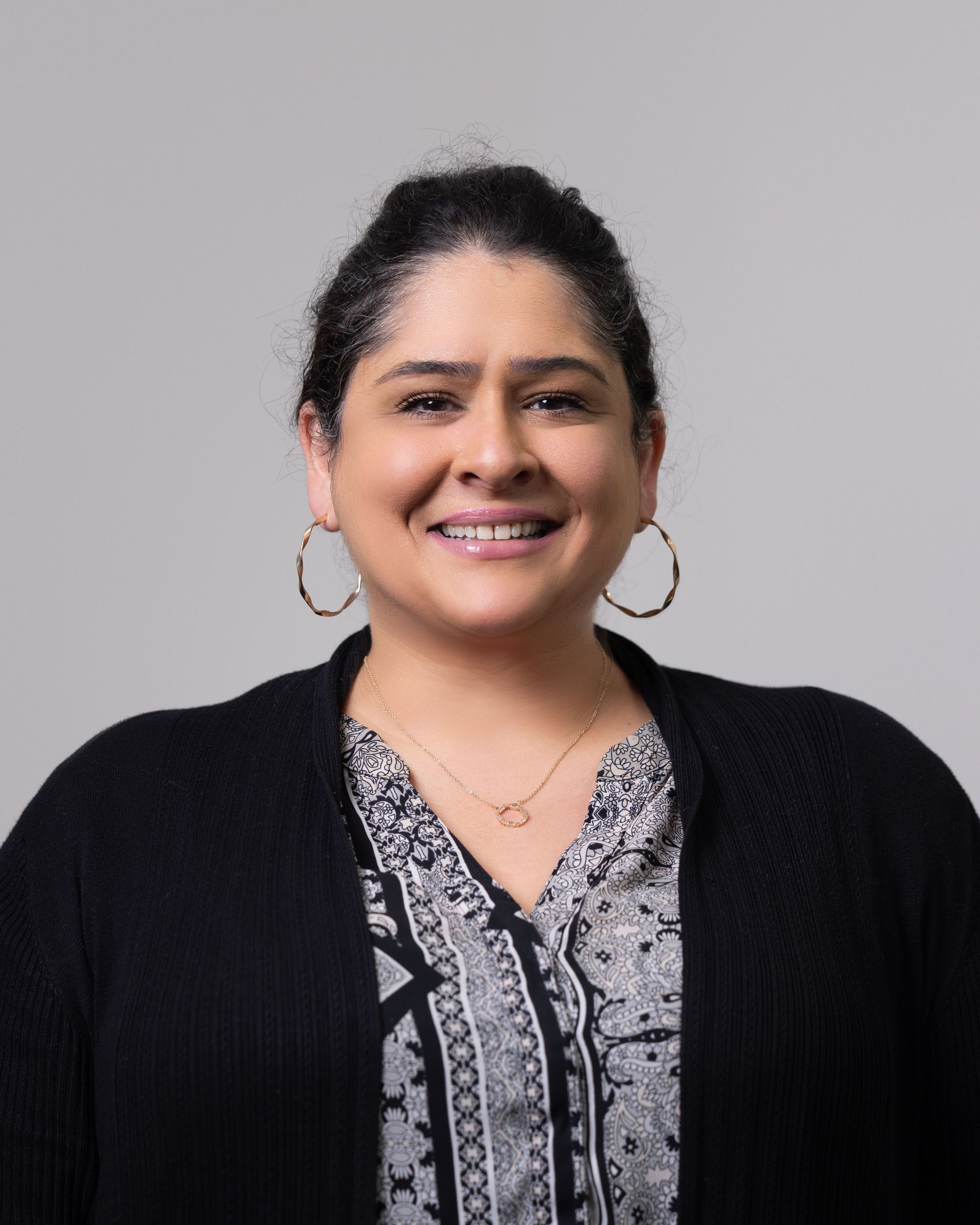 A large building with balconies and hanging potted plants