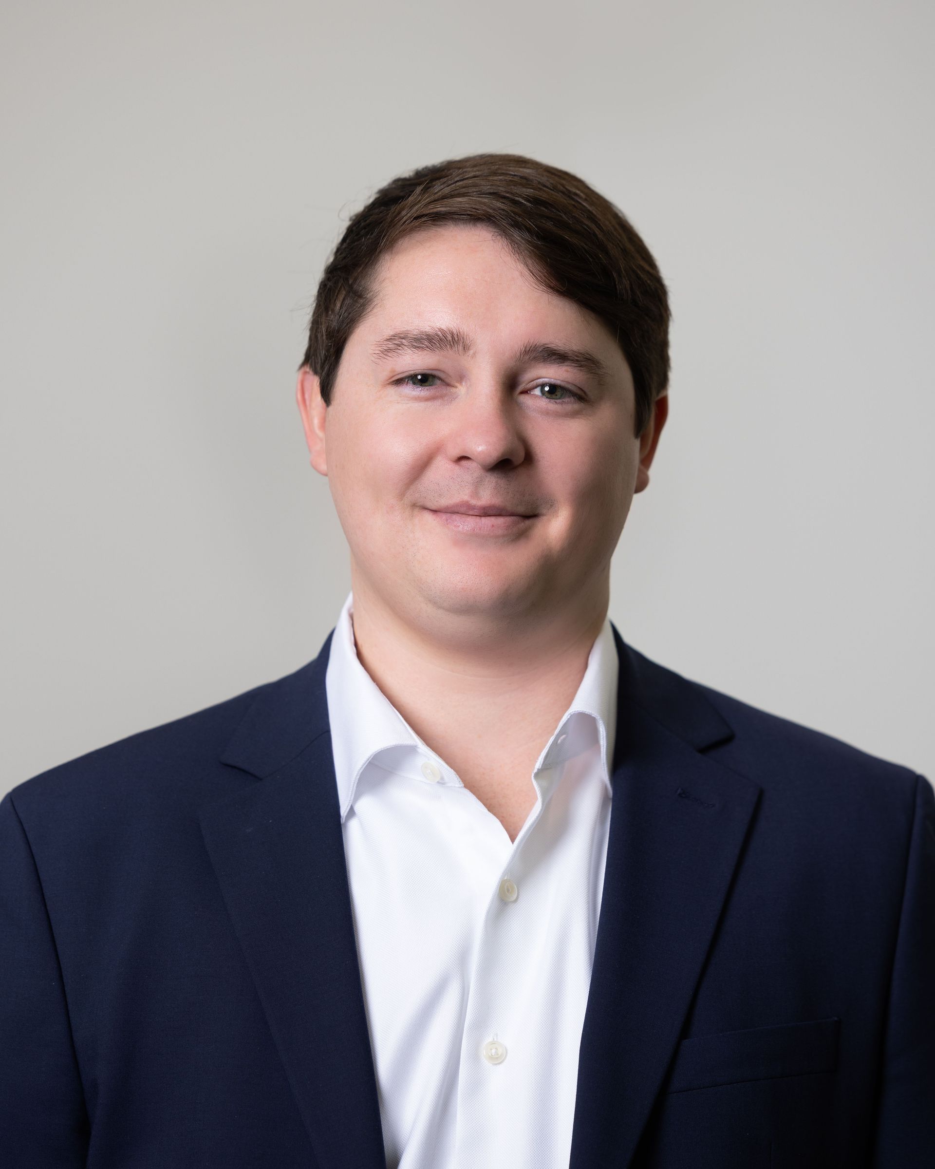 A large building with balconies and hanging potted plants