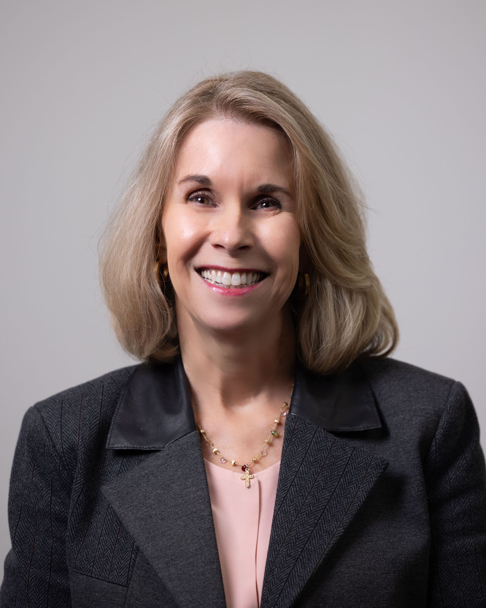 A large building with balconies and hanging potted plants