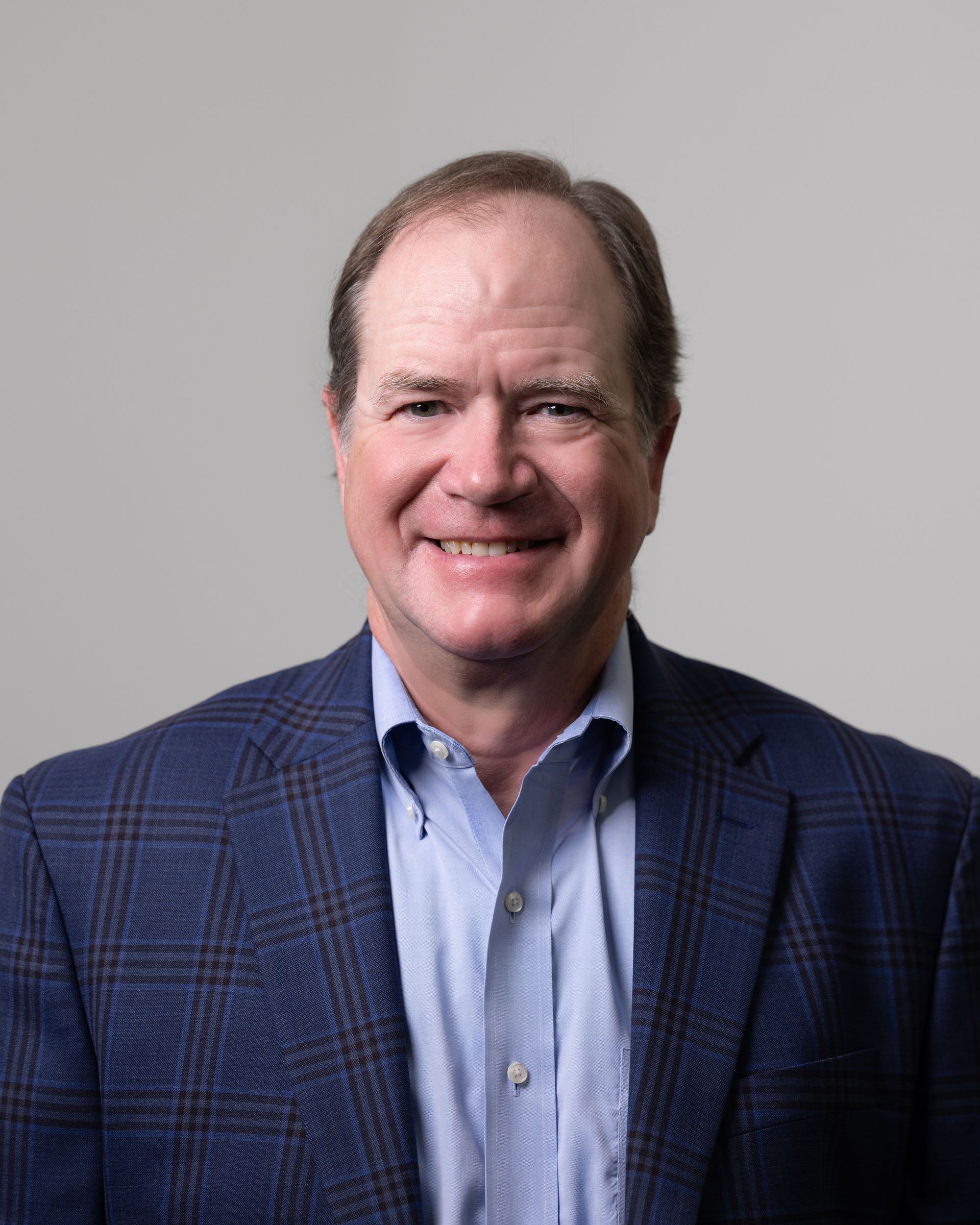 A large building with balconies and hanging potted plants