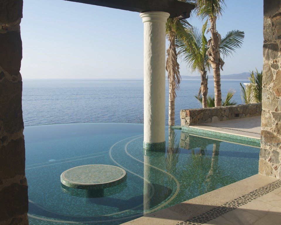 A swimming pool with a view of the ocean