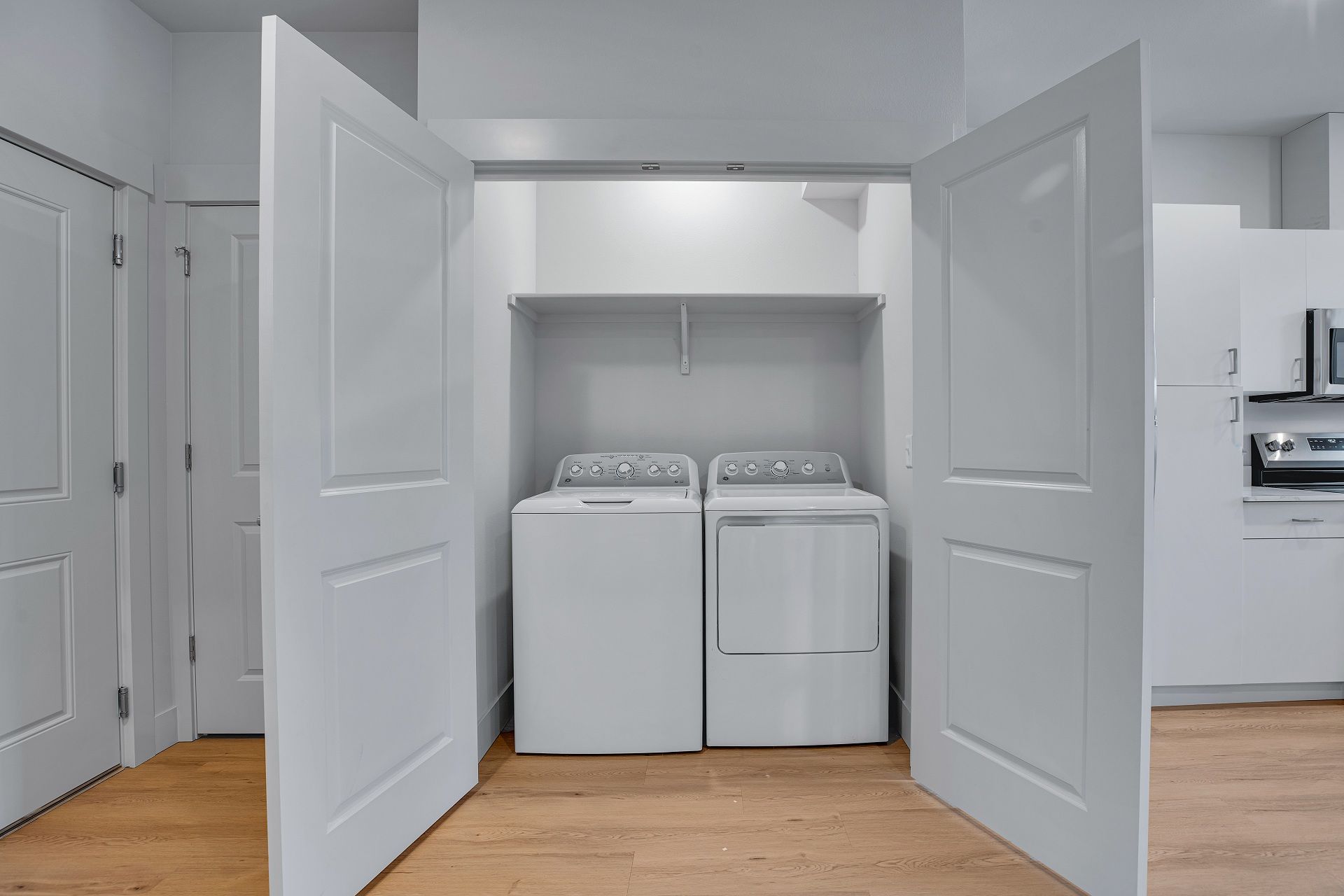 A laundry room with a washer and dryer in it.