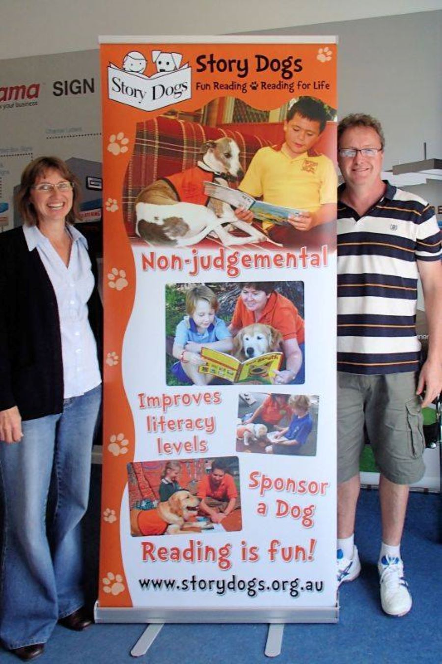 Two People Standing Next to a Sign — Print Spot Group in South Murwillumbah, NSW