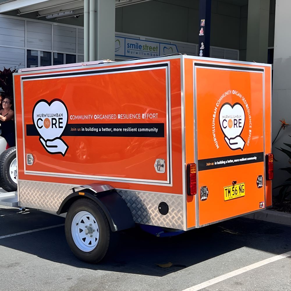 An Orange Trailer With the Word Core on It — Print Spot Group in Kingscliff, NSW