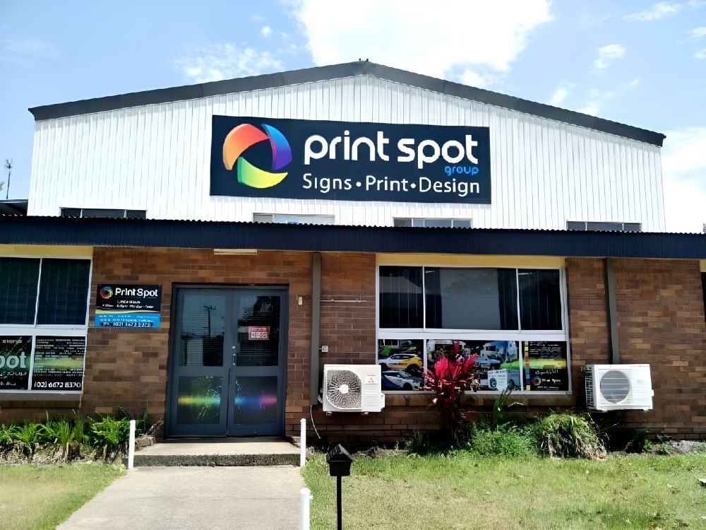 Building With A Sign that Says Print Spot On It — Print Spot Group in Byron Bay, NSW