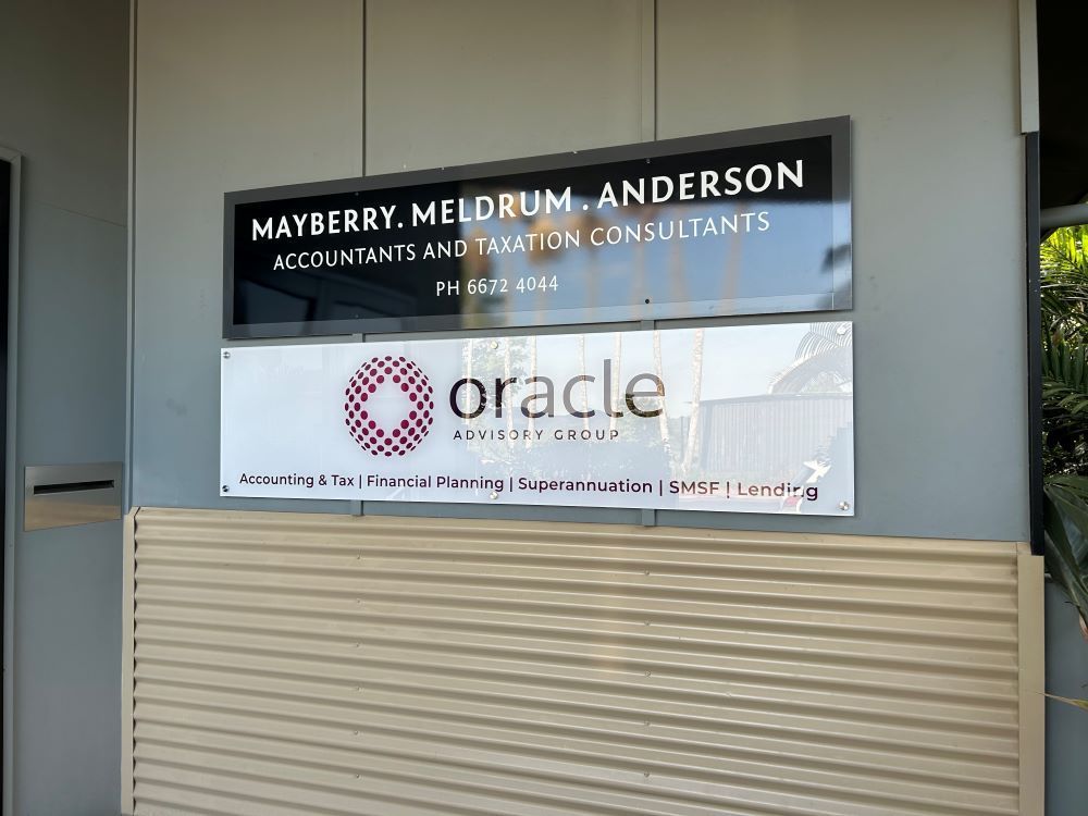 A Sign on the Side of a Building — Print Spot Group in Tweed Heads, NSW