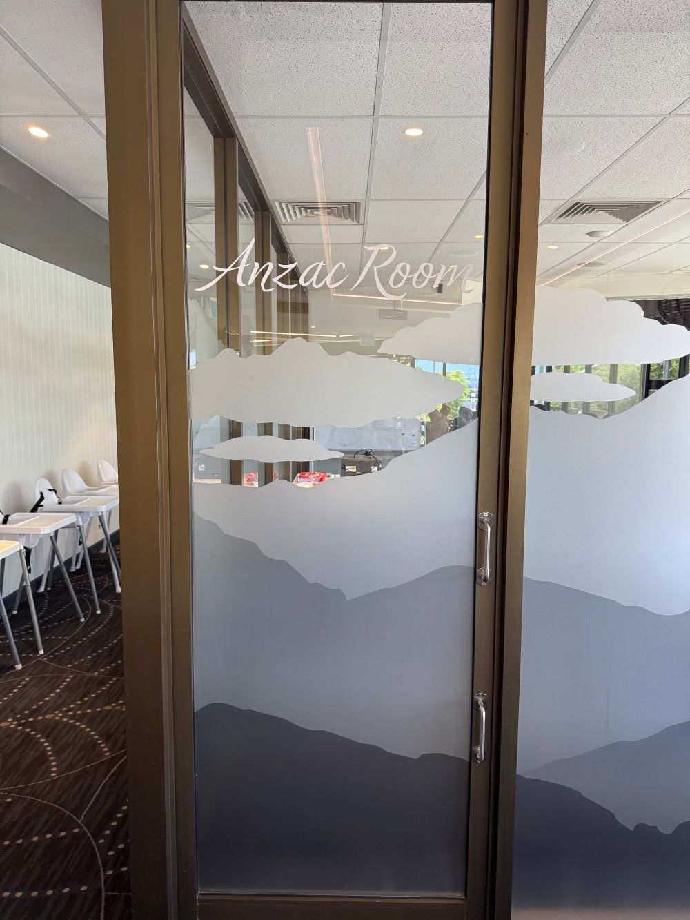 A Glass Door With a Picture of Mountains on It — Print Spot Group in Coolangatta, NSW