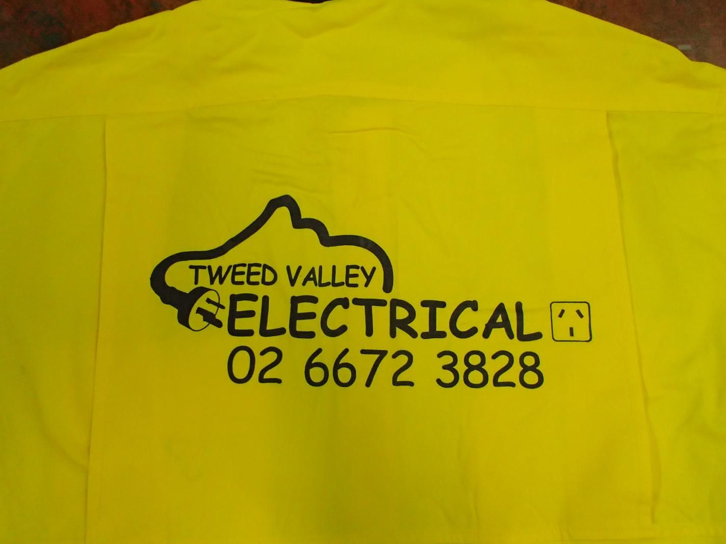 Tweed Valley Electrical Sign On A Yellow Shirt — Print Spot Group in South Murwillumbah, NSW