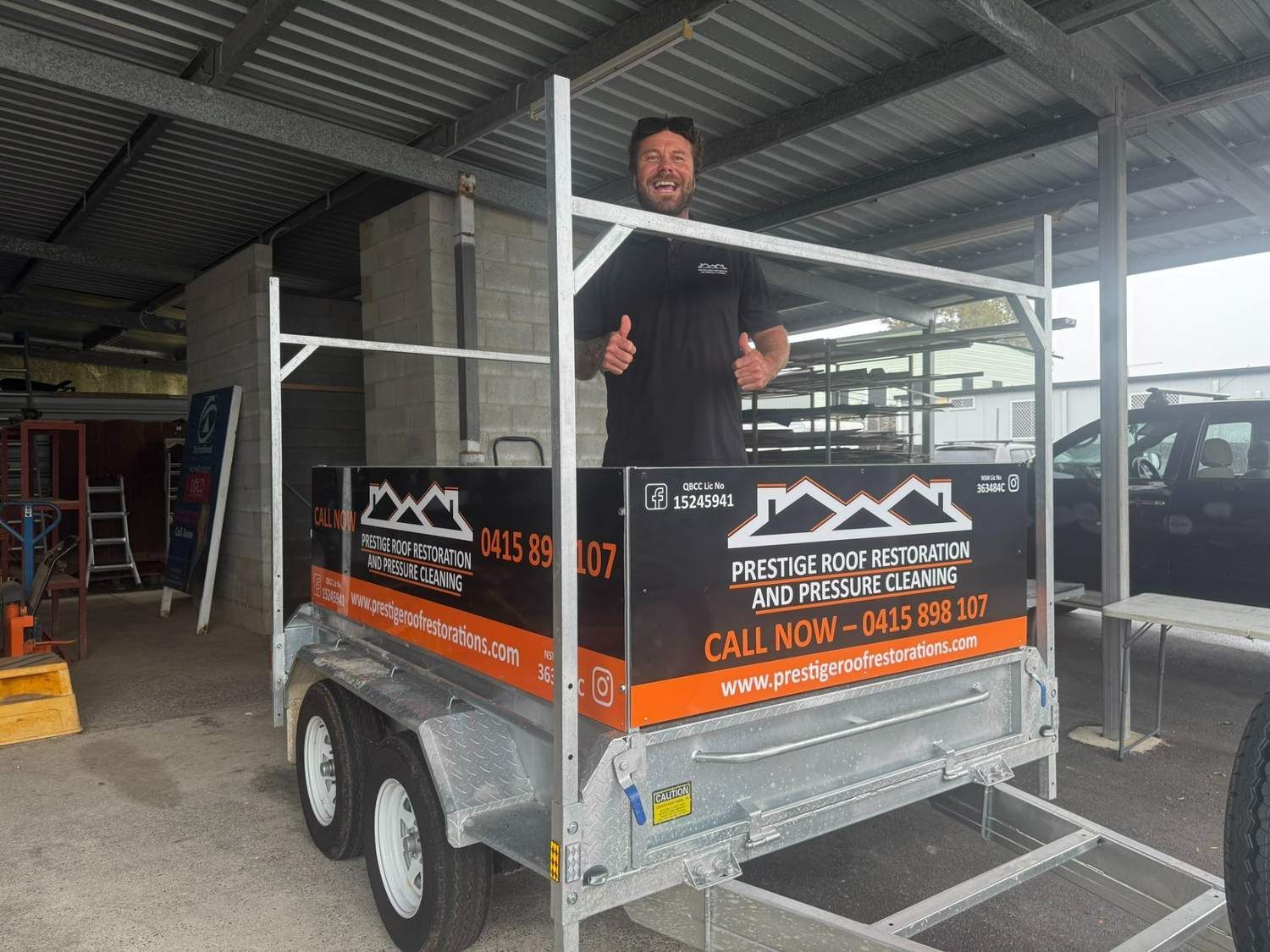 A Man Standing on a Trailer — Print Spot Group in South Murwillumbah, NSW