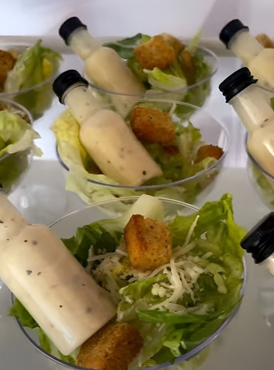 a tray of cups filled with fruit on a table .