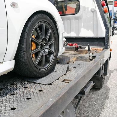 Experienced Towing Service — Car Being Tow by a Towing Truck in Canoga Park, CA